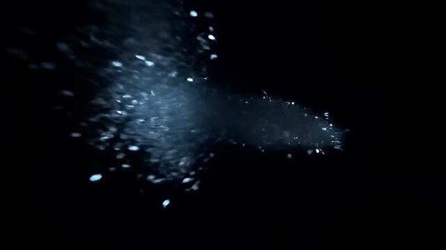 An airy plume of glimmering water-like particles against a backdrop of inky blackness - Powered by Adobe