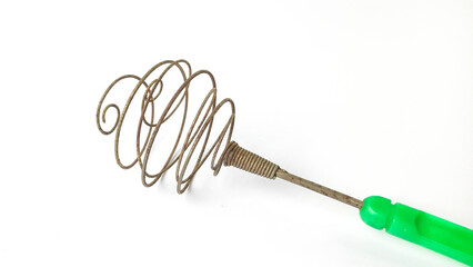 rusty egg beater cooking utensils isolated on white background.