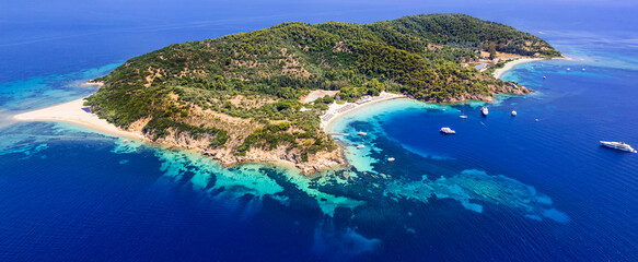 Fototapeta premium Greece, Best beautiful beach destinations of Skiathos island (Sporades) - stunning island Tsouguria with white sandy beaches . High angle drone aerial view
