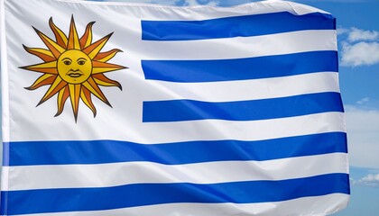 Flag of Uruguay with nine horizontal white and blue stripes, featuring the Sun of May in the top left&mdash;symbolizing liberty, independence, and national pride.