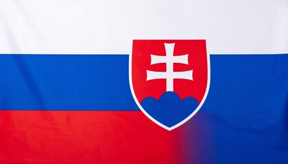Obraz premium Slovakia flag featuring horizontal stripes of white, blue, and red with a red shield displaying a white double cross on three blue hills