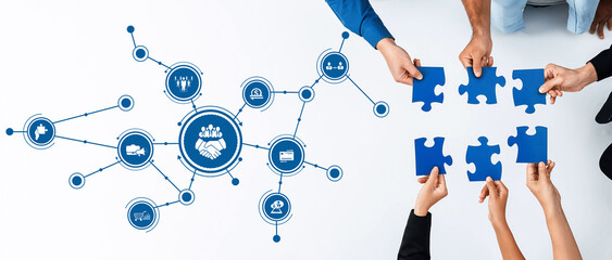 This image features diverse hands assembling blue puzzle pieces, set against a network of icons...