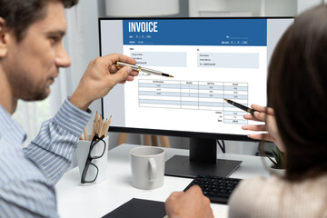 Invoice on computer screen from accounting application. Computer program for financial and budget...