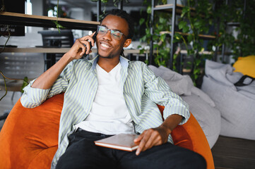 African american student relaxing while studying