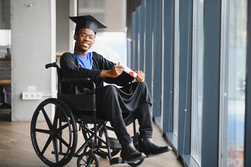 Man with disability. Celebrating academic achievement in a wheelchair