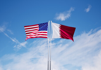 flags of qatar and united states of america over blue sky background.