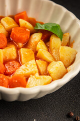 Stewed potatoes with carrots vegetarian side dish fresh delicious gourmet food background on the table rustic food top view copy space keto and paleo diet vegan food