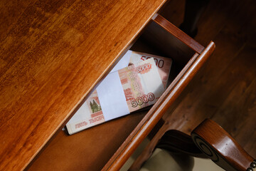 Five Thousand Rubles Banknotes In Stack  in the drawer of the desk. Selective focus