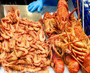Lobsters and shrimips being sold at The Queen Victoria Market. Built in 1860 years it is one of Melbourne's major tourist sites. Australia, Melbourne, Dec 2019