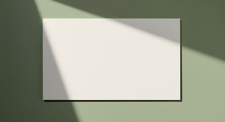 Fototapeta premium Cotton Writing Paper on Gentle Sage Background in Natural Sunlight – Minimalist, Blank, and Unlabeled Mockup for Branding, Stationery, Invitations, Office Supplies, and Creative Product Presentations