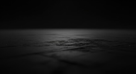 Abstract macro shot of dark textured surface with subtle light reflection