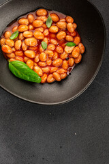 Bean stew tomato sauce cranberry beans vegetable dish beans borlotti fresh delicious gourmet food background on the table rustic food top view copy space keto and paleo diet vegan and vegan food