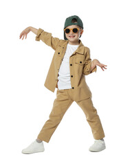 Happy little boy in sunglasses and baseball hat dancing on white background
