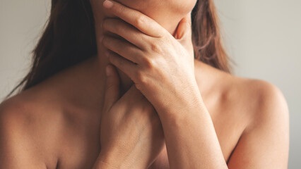 A young woman with a sore throat