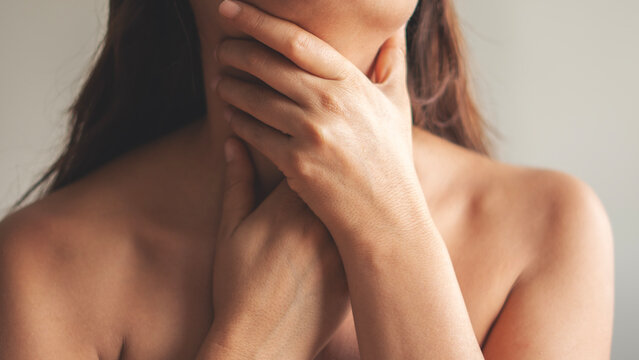 A young woman with a sore throat