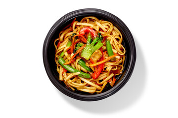 Udon noodles with vegetables in a take away bowl on white background