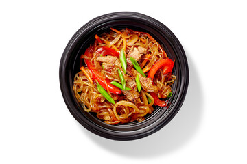 Delicious asian noodles with beef and vegetables in black bowl