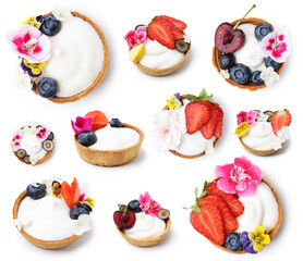 Tartlets decorated with flowers isolated on white, set. Tasty dessert