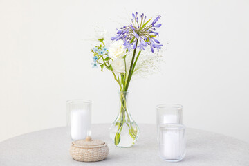 Beautifully Arranged Glass Vase with Colorful Flowers and Candles on Minimalistic Table Setting for Elegant Home Decor