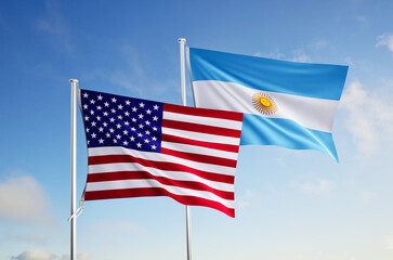 flags of  argentina and United States of America over blue sky background.