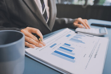 Business financing accounting banking concept. Business woman hand doing finances and calculate on...