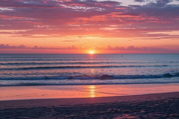 Obraz premium Tranquil Beach Sunset Over Lively Ocean Horizon