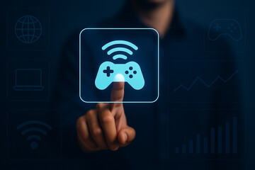 Futuristic man touching holographic wireless game controller icon on digital screen interface with virtual data UI for gaming technology