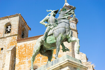 Fototapeta premium Equestrian monument of heroic figure in Trujillo, Extremadura at midday under a clear blue sky