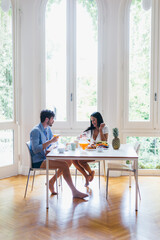 Couple in love eating breakfast in the morning