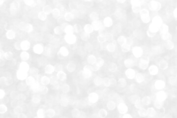 White and gray bokeh background. Photo can be used for the concepts of New Year, Christmas, Wedding Anniversary and all celebrations.