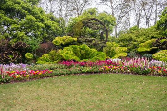 West Lake gardening Hangzhou, China. Vibrant spring flowerbed and sculpted topiary art .