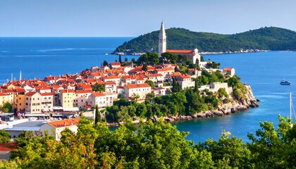 Obraz premium Coastal town nestled on a hill overlooking a vibrant blue sea