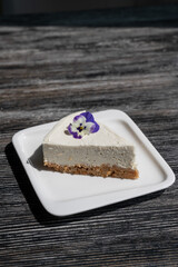 A piece of cheesecake on a white plate. 