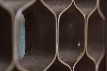 Unique textures and shapes in a vintage storage unit reveal hidden beauty
