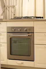 Fototapeta premium Classic built-in stainless oven in white shaker kitchen