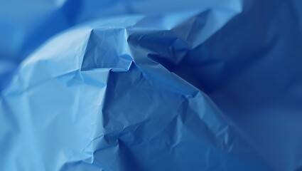 Obraz premium Wrinkled Blue Sheet for Background, Crumpled Surface Texture of a Synthetic Material in Cool Tone, Blue Background with Folds
