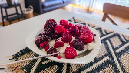 Frozen Berries with Yogurt on Table