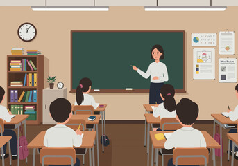 A teacher instructs students in a classroom setting, with desks, blackboard, and educational posters visible.