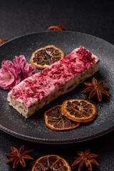 Nougat or white caramel with hazelnuts and strawberry pieces. White nougat