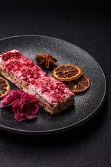 Obraz premium Nougat or white caramel with hazelnuts and strawberry pieces. White nougat