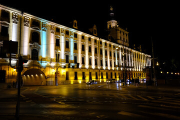 Fototapeta premium Historic building with bright facade and night lighting.