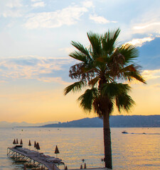 Sunset on the coast looking out to sea at Juan Les Pins on the French Riviera in the south of...
