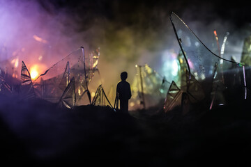 A silhouette of a person against the background of shattered glass. An abstract world made of glass...