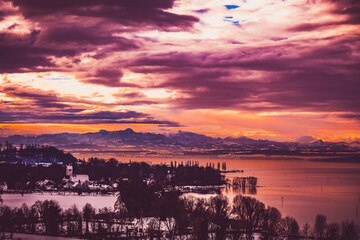 Panoramic view of a lake with a colorful sunset.