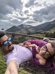 Playful Couple Resting in Hammock – Relaxation, Freedom, Joy, Tranquility, Nature, Lounge, Resort, Laughing, Bonding, Outdoors, Tropical Forest, Calm, Sunny, Comfortable