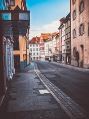 Empty old town street with cobblestones and charming houses in soft tones – quiet and nostalgic.