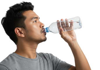 Man drinking water from a clear plastic bottle isolated on transparent background