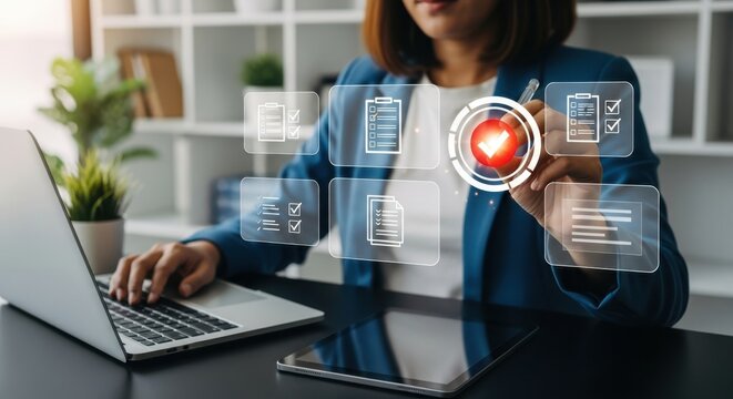 A businesswoman uses a laptop and tablet, interacting with a digital interface displaying business processes