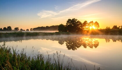 Obraz premium Sunrise over misty river