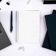 Top view of office table with laptop, pen, nootbook and stationery in home office room, clipping path. Desktop mock up.